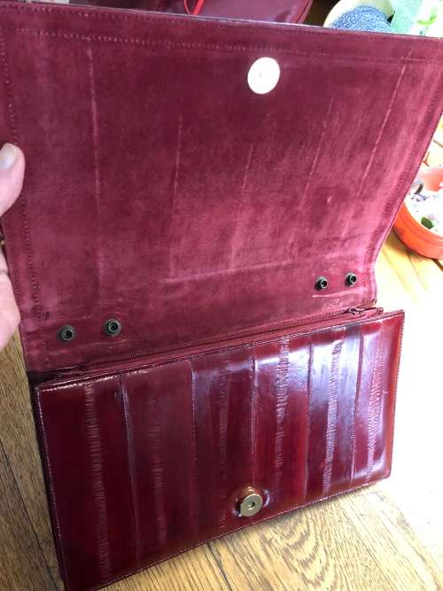 Genuine eelskin rusched clutch handbag